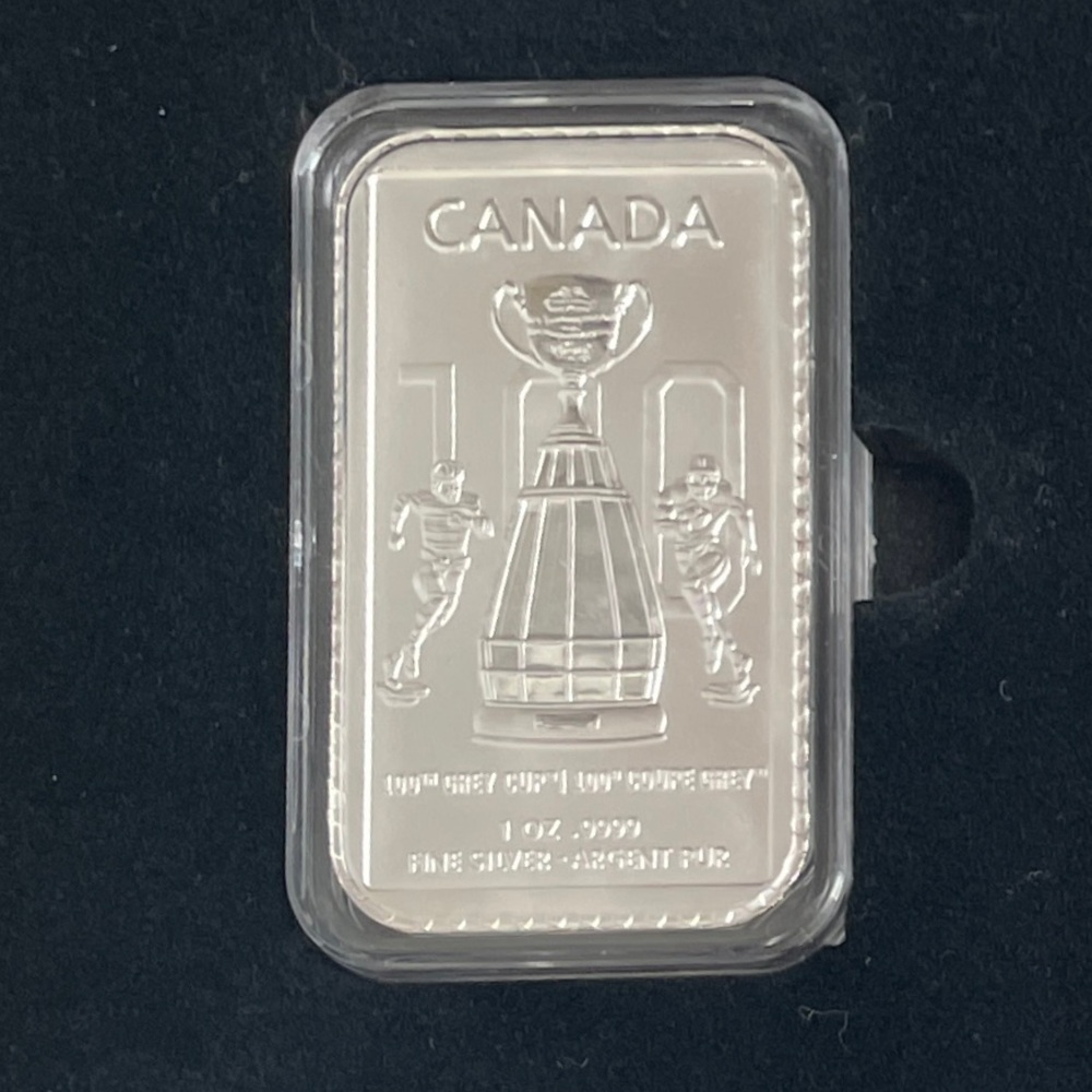 Canada Silver 1oz 999% bar comes with this CFL Football Trophy, box, pins,stamps